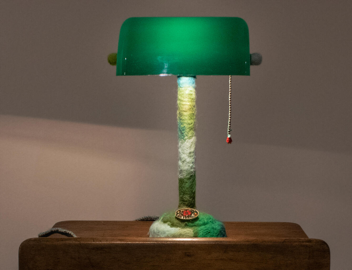 Soft Light #2, 2022, needle felted wool, lamp, crochet-covered pull-cord and cord, vintage brooch, 6" x 10" x 14"